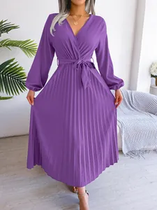 Close-up showing the pleated texture and V-neck silhouette of the purple long dress