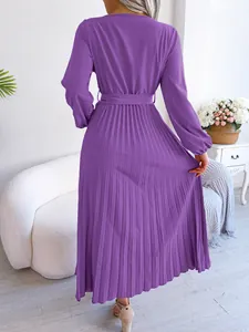 Detailed back view of this elegant purple long sleeve pleated maxi dress with belt