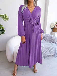 Elegant purple V-neck pleated maxi dress with long sleeves and adjustable tie waist.