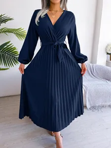 Elegant navy blue wrap V-neck pleated maxi dress with long sleeves and waist belt