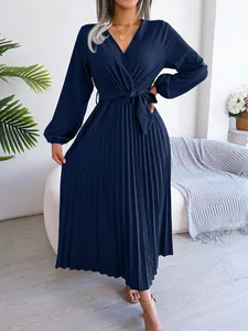 Elegant navy blue pleated maxi dress with cross V-neck and long sleeves for autumn