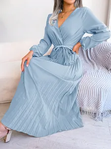 Elegant light blue V-neck pleated maxi dress featuring long sleeves and a waist tie