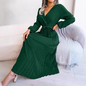 Elegant dark green V-neck pleated maxi dress with long sleeves and belted waist