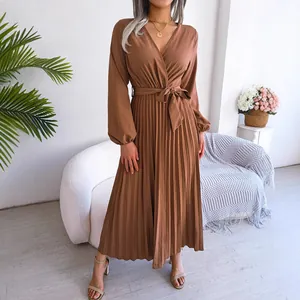 Elegant brown long sleeve pleated maxi dress featuring a V-neck and a stylish waist tie