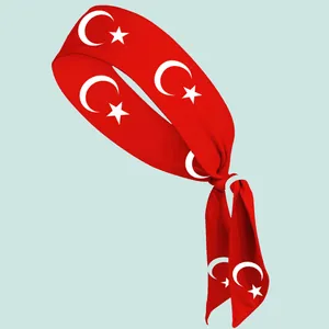 Close-up of a red sports tie headband with white Turkish flag crescent and star design.
