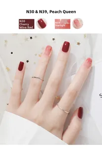 Detail of peelable water-based nail polish in cherry wine red and starry pink