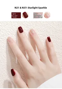 Detailed view of hand showcasing deep burgundy and shimmering silver water-based nail polish