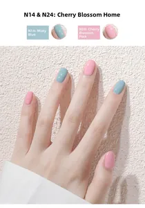Close-up of elegant hands showing misty blue and cherry blossom pink nail polish colors