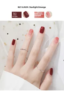 Manicured hand showing burgundy and pink glitter gradient nail polish details