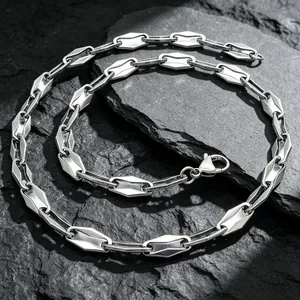 Close-up of geometric stainless steel hexagonal link chain necklace with lobster clasp