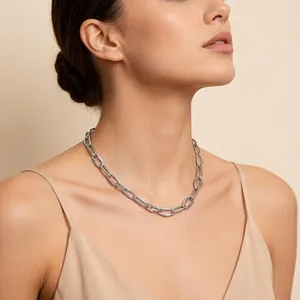 Silver geometric stainless steel chunky link necklace shown worn on neck detail