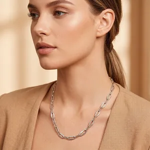Close-up of a geometric silver link necklace on a model for a chic, modern look.