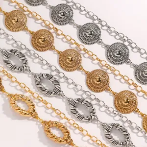 Detailed view of ethnic style gold and silver metal chain belts for women's dresses