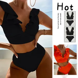Detailed view of women's two-piece bikini set with ruffle top and high-waisted bottom.