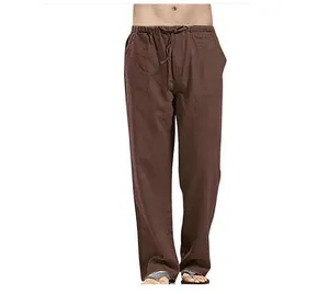 Men's loose linen trousers with elastic drawstring waist and patch pockets detail.