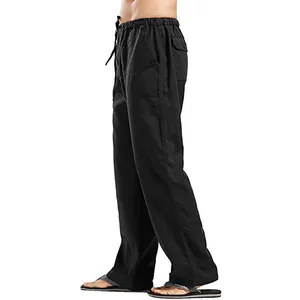 Side view of men's loose black linen trousers with comfortable drawstring waist.