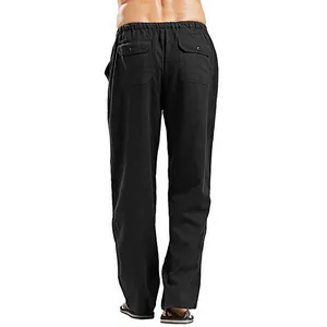 Detailed rear view of men's loose black linen pants featuring buttoned back pockets
