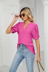 Detailed view of women's fuchsia V-neck t-shirt with eyelet puff sleeves