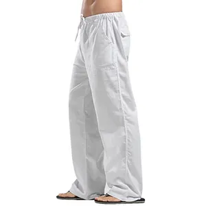 Side view of men's loose white linen pants with drawstring and pockets