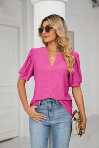 Casual women's pink V-neck top with intricate eyelet pattern and stylish puffed sleeves