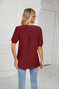 Back view of burgundy V-neck hollow-out blouse with short puff sleeves for women