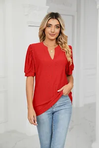 Detail shot of a red short-sleeve V-neck top featuring delicate eyelet embroidery for women
