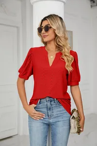 Red short sleeve V-neck top with eyelet pattern and puff sleeves on model