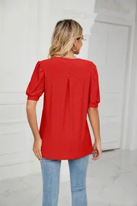 Detailed back view of a red eyelet embroidered puff sleeve loose summer top for women