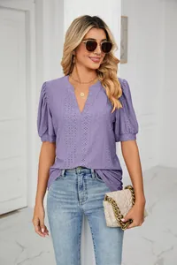 Detailed view of women's purple V-neck eyelet top with elegant puff sleeves