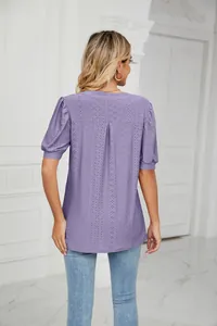 Back view of purple v-neck eyelet puff sleeve blouse showing hollow-out detail