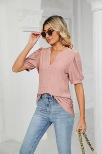 Detail shot of a casual pink V-neck hollow puff sleeve t-shirt for women in summer