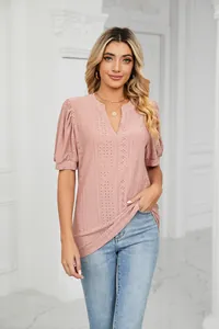 Full view detail of pink V-neck eyelet top with stylish puff sleeves and casual fit