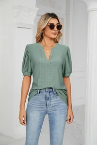 Stylish sage green V-neck t-shirt featuring intricate eyelet pattern and puff sleeves
