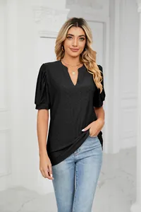 Elegant woman wearing a black V-neck summer top with hollow lace pattern and puff sleeves