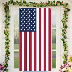 Close-up detail of the American flag Independence Day door banner hanging on a white porch.