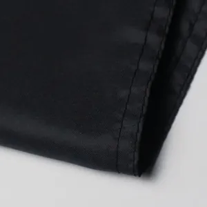 Macro shot of high-quality stitching on durable black fabric for garden banner decoration