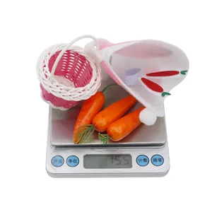 Macro view of festive Easter goose accessories on a digital scale weighing 15.5 grams