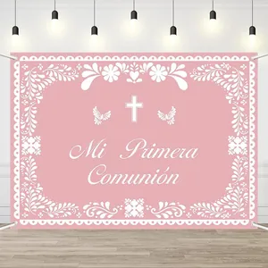 Detailed view of pink floral First Communion backdrop with Mi Primera Comunión text.