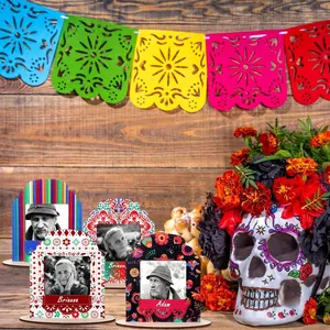 Day of the Dead wooden photo frames on Mexican ofrenda altar with sugar skull