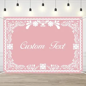 Detailed view of pink Mexican baptism backdrop with white lace floral pattern and custom text