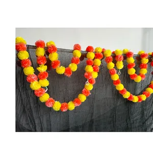 Close-up of vibrant orange and yellow marigold flower garlands for festive home decoration