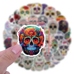 Detailed size view of colorful Day of the Dead skull sticker, 4.9x5.4 cm dimension markings.