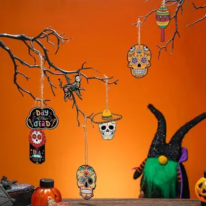 Detail of Day of the Dead wooden skull hangings on black decorative party branches