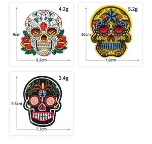 Detailed view of colorful Day of the Dead sugar skull embroidery patches with size specs.