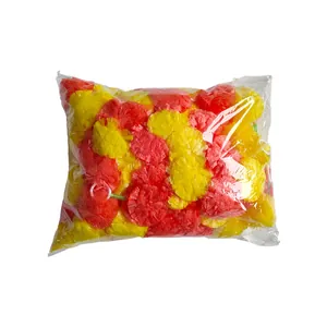 A clear bag of colorful red and yellow plastic marigold flower heads for party decor