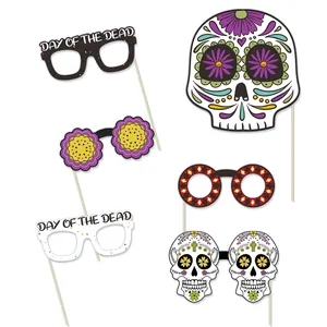 A set of six Day of the Dead party photo booth props featuring colorful sugar skull designs.