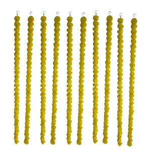 Close-up of ten vibrant yellow marigold garlands showing detailed floral texture and loops