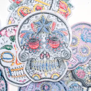 Set of colorful Day of the Dead sugar skull embroidered patches for clothes and bags
