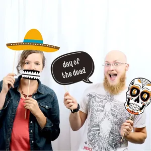 Diverse Day of the Dead photo booth props with sugar skull and sombrero designs