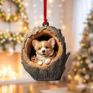 Detail view of a cute Corgi puppy nestled in a tree stump hanging Christmas ornament.